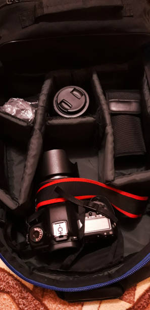 istock Professional photography equipment in backpack, top view. Space for text 1387831441
