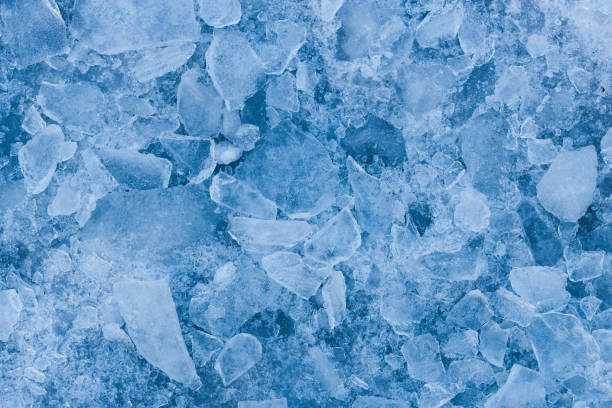 istock beautiful blue cracked ice. frosty texture 1387832351