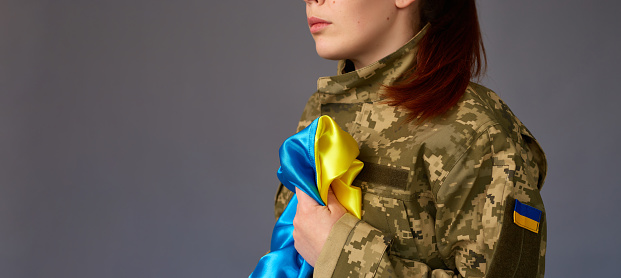 Ukrainian female in military uniform ready to defend her motherland. Armed Forces of Ukraine
