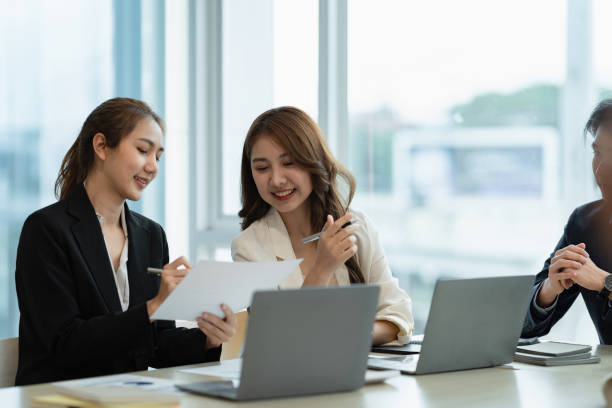 istock Group of Business people and Accountant checking data document on digital tablet for investigation of corruption account. Anti Bribery concept. 1387832711