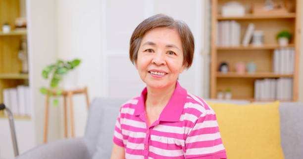 istock elderly woman smile at you 1387834027