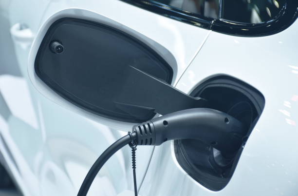 istock plug in electric vehicle charging to electrical car 1387835273