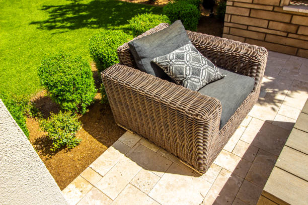 istock Large Wicker Arm Chair On Back Yard Patio 1387838898