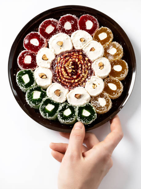 istock Turkish delight Turkish sweets on a plastic plate, on a white background. 1387839934