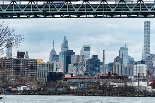 Robert F. Kennedy Bridge - New York, NY and the Manhattan Skyline and the East River as viewed from Astoria Park