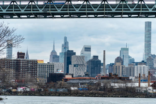 Robert F. Kennedy Bridge Robert F. Kennedy Bridge - New York, NY and the Manhattan Skyline and the East River as viewed from Astoria Park harlem park stock pictures, royalty-free photos & images