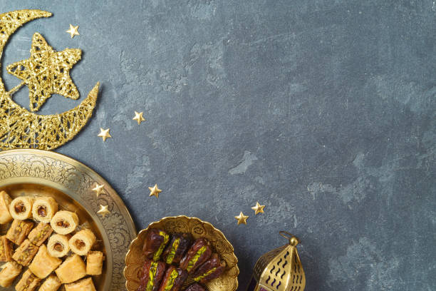 istock Flat lay composition for Ramadan kareem holiday with dried dates, Ramadan sweets and decorations. Top view background 1387841909