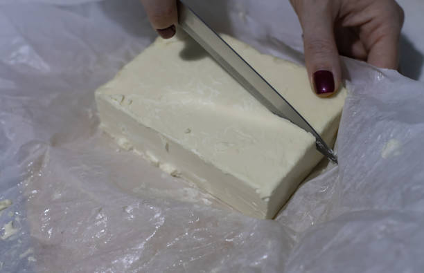 istock a large piece of butter cut with a knife 1387844959