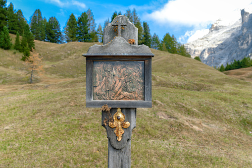 A historical wayside shrine at a hiking path undeneath the Sasso di Santa Croce mountain in Alta Badia South Tyrol