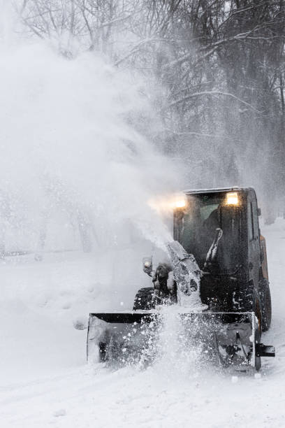 istock a snowplow tractor rides the park alley 1387846401