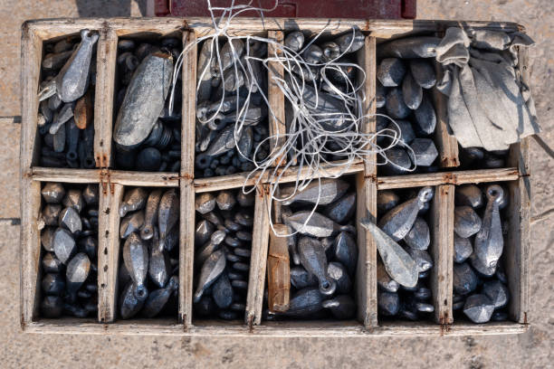 Fishing leads in a wooden box. Hunting, fishing, hunting equipment concept.
