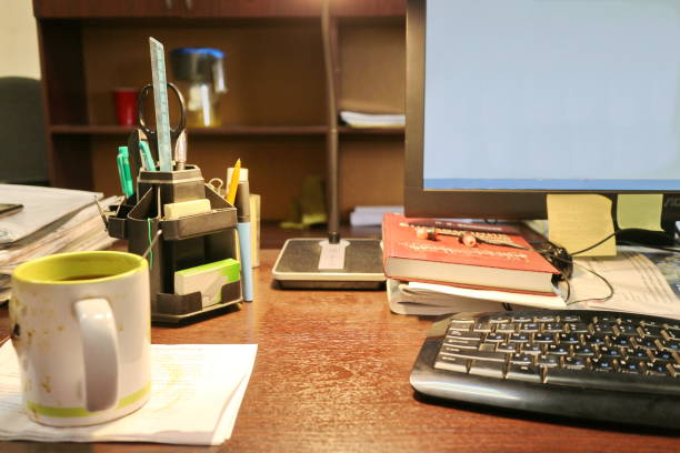 notebook, pen, keyboard, folders on the office desk