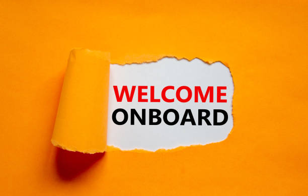 Welcome onboard onboarding symbol. Concept words Welcome onboard appearing behind torn orange paper. Beautiful orange background. Business, welcome onboard onboarding concept, copy space. stock photo