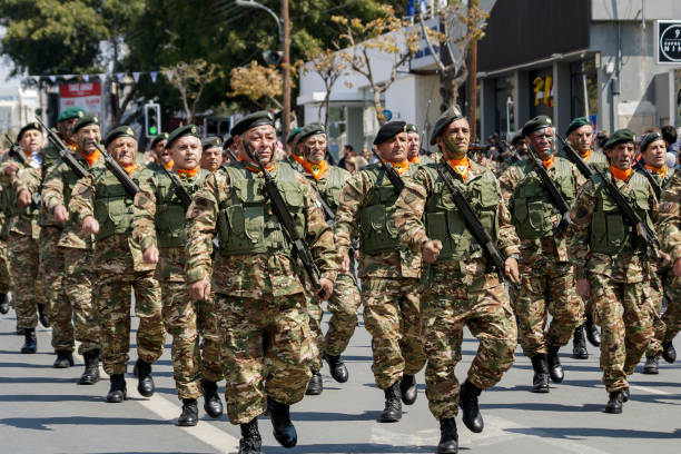 Limassol, Cyprus, March 25th, 2022: Cypriot National Guard members in camouflage uniform marching along the Archbishop Makarios III Avenue during the Greek Independence Day parade