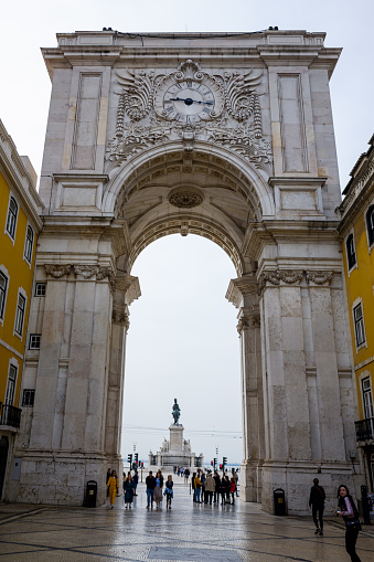 Lisboa , Portugal; 26 March 2022: General view of August Street arch with people passing under it
