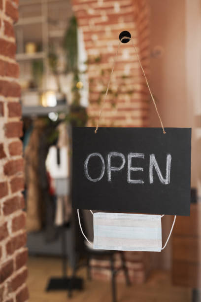 istock Open Sign On Glass Door 1387853922