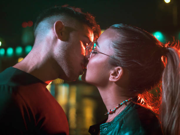 istock Passionate young couple dating at the night 1387856829