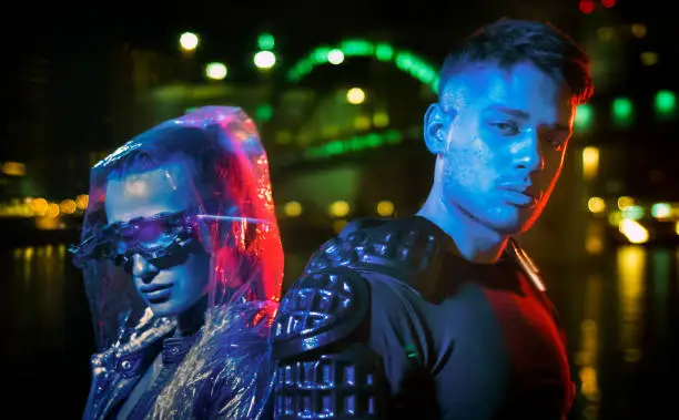 Metaverse man and woman in futuristic neon city