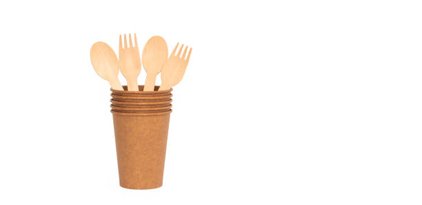 istock Eco brown cup and wooden fork, spoon on a white background. Mockup for your and copy space 1387857746