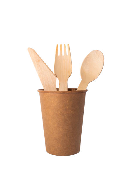 istock Eco brown cup and wooden khife, fork, spoon on a white background. Mockup for your and copy space 1387857768