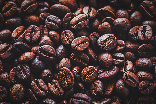 Coffee beans background, dark roasted coffee-beans closeup