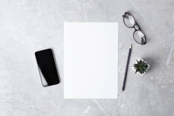 Blank paper sheet on grey background, flat lay