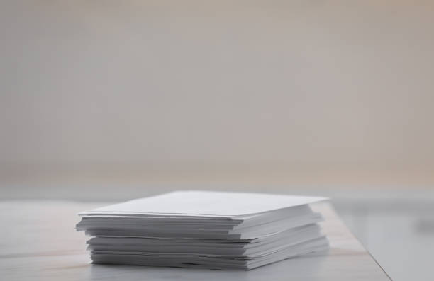 stack of blank paper sheets on table in office, closeup - paper stack heap index card imagens e fotografias de stock