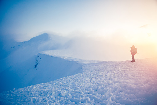 The range is lit by the charming evening light. Frosty day on ski resort. Location Carpathian, Ukraine, Europe. Picture of wild area. Explore the beauty of earth. Scenic image of hiking concept.