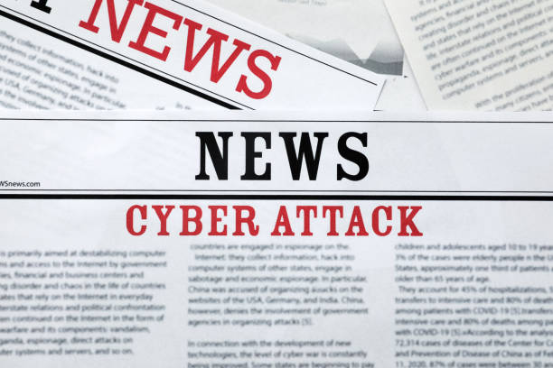 istock Newspapers with headline Cyber Attack as background, closeup 1387858753