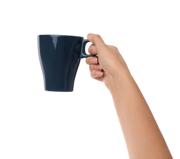 istock Woman holding elegant dark blue cup on white background, closeup 1387859077