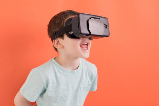 istock Child in virtual reality headset glasses 1387859079