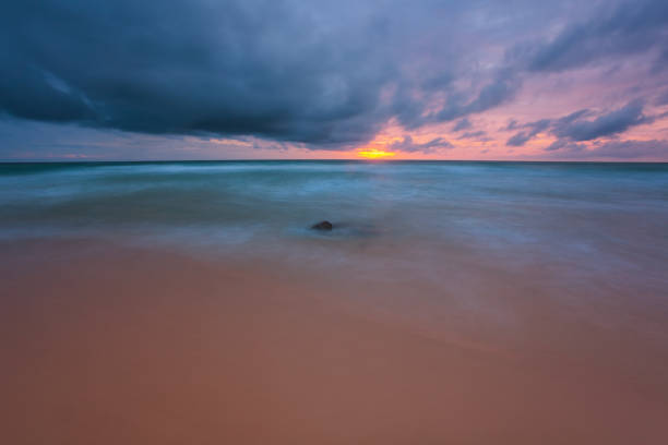 istock Colorful tropical beach at sunset 1387859303