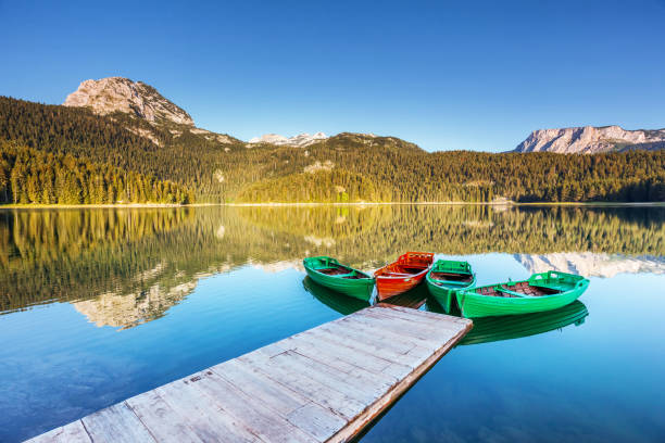 Beautiful view of Black lake on sunny day. Location National park Durmitor, Montenegro, Europe. Beautiful view of Black lake on sunny day. Location National park Durmitor, Zabljak, Montenegro, Europe. Scenic image of amazing nature landscape. Wonderful summer scene. Discover the beauty of earth. durmitor national park photos stock pictures, royalty-free photos & images