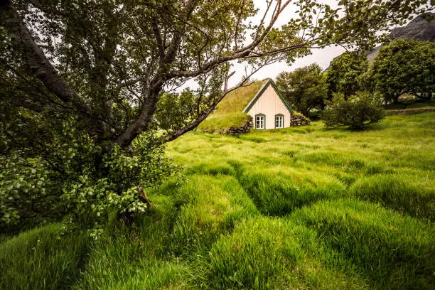 Photo of Amazing view of turf church Hofskirkja. Location place of Iceland, small village Hof, Europe.