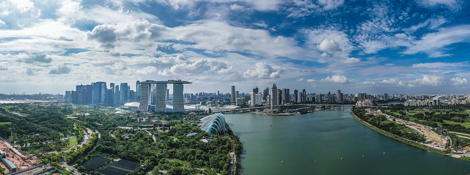 Aerial view of Singapore skyline showing the financial district of Singapore and the famous Marina Bay Sands hotel which is the iconic landmark of Singapore. Seen at day in the summer.