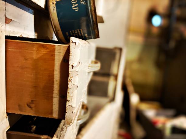 istock Old Painted Drawer in a Messy Basement 1387864081