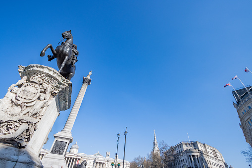 Charles I Monument (cast in 1633 by Hubert Le Sueur and erected in this position in 1675) and Nelson's Column (built by 1843 to a design by William Railton).