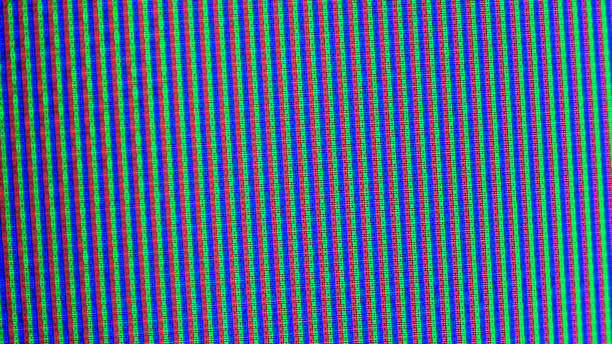 istock Close up view at a plasma tv while showing television activity. 1387865019