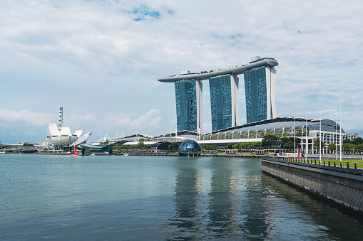 Singapore, Singapore - April 13, 2013: The Singapore River with the skyline of Raffles Place at early afternoon on April 13, 2013 in Singapore. Singapore River is a river near Central Area in the southern part of Singapore.