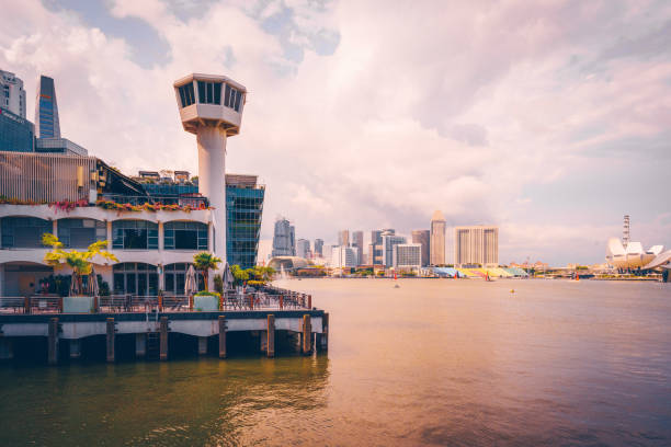 A lighthouse at Fullerton Bay in Singapore opposite side of the Singapore River. Seen a cloudy day in the summer.