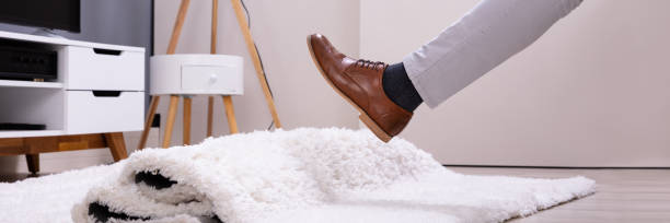 istock Man Legs Stumbling With A Carpet 1387865877
