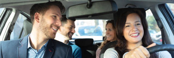 istock Smiling People Sitting In Car 1387865942
