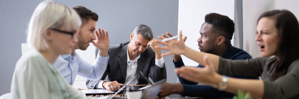 istock Business People Arguing In Meeting 1387865980
