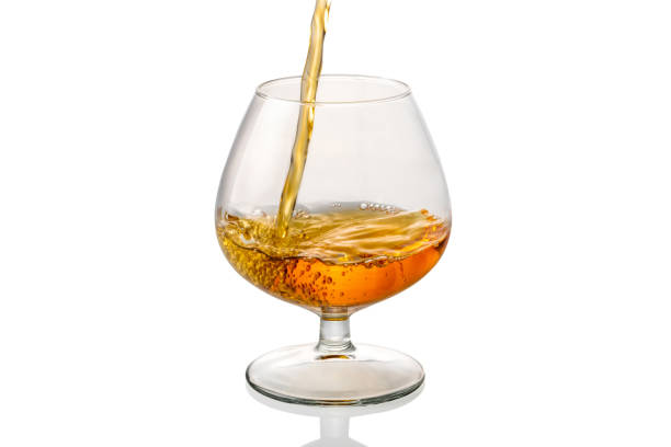 istock french cognac poured into glass 1387866179
