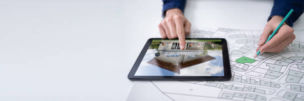 istock Hand Holding Pencil Over Cadastre Map New Tablet 1387866257
