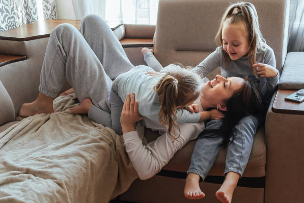istock Happy family having fun at home 1387866860