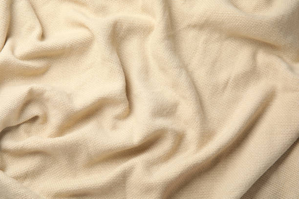 istock Soft warm beige plaid as background, closeup 1387867186