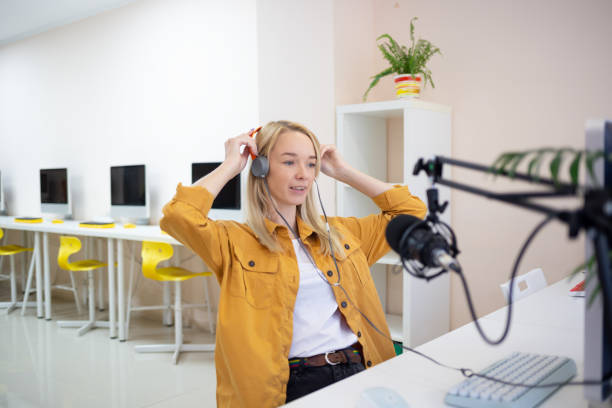 istock young woman is streaming while sitting in coworking at the computer 1387867319