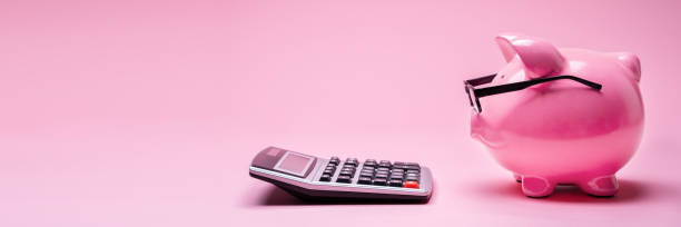 istock Piggybank And Calculator 1387867395