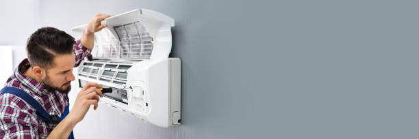 istock Repairer Repairing Air Conditioner 1387867438